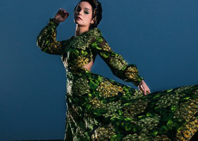 Model wears green pattern dress