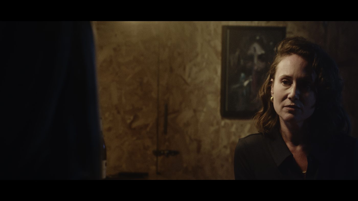 Production still — dinner scene